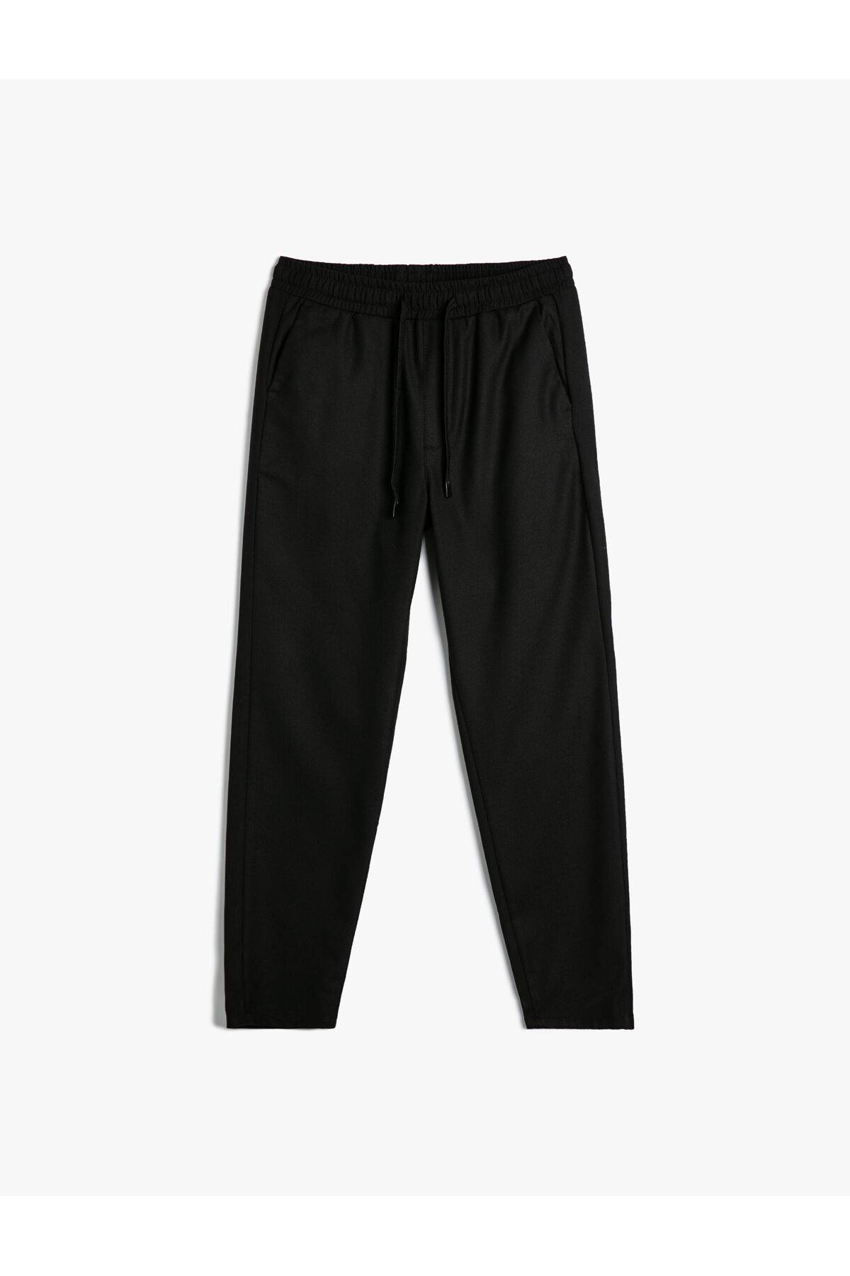 شلوار پارچه ای با جزییات جیب باریک کمربند توری