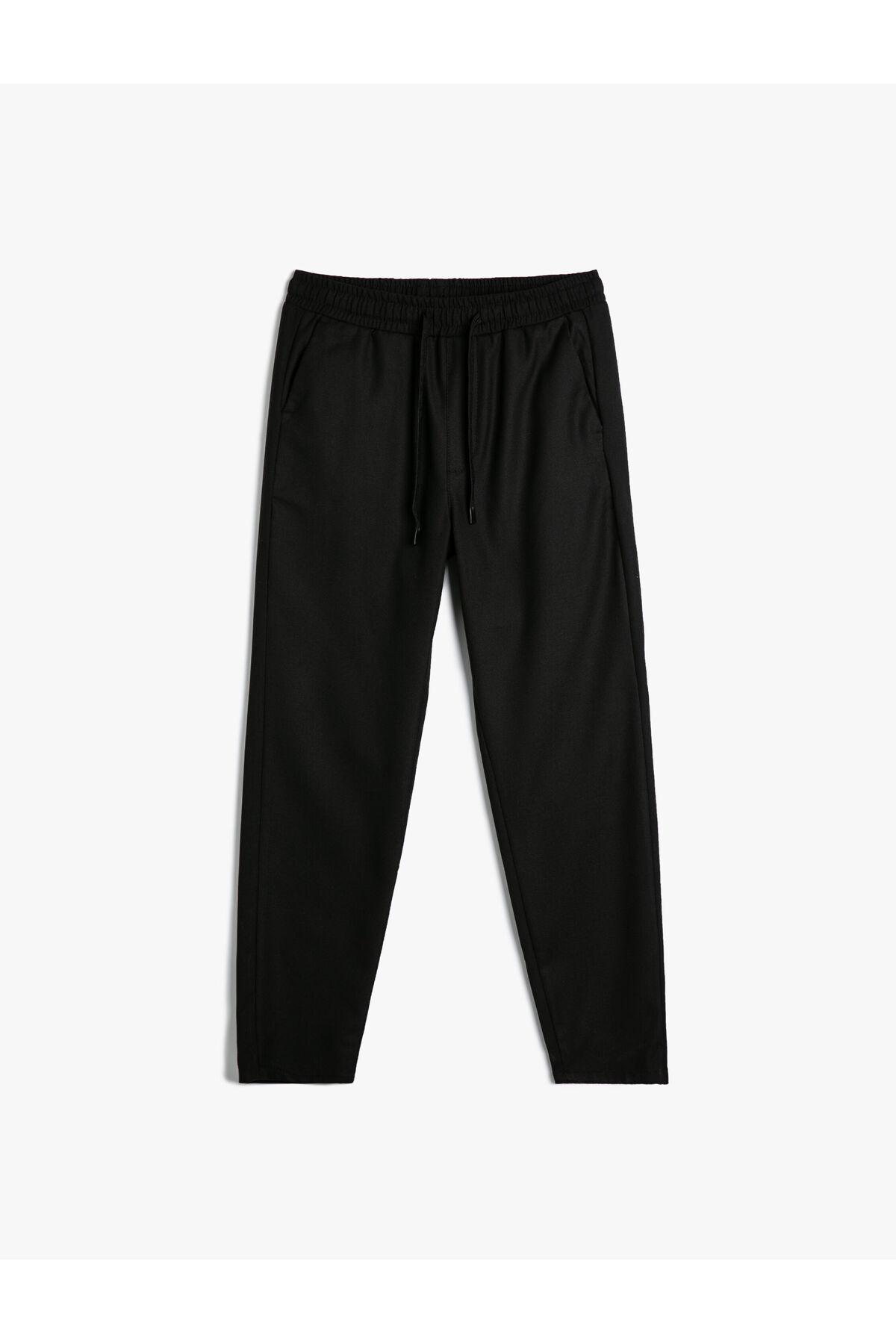 شلوار پارچه ای با جزییات جیب باریک کمربند توری