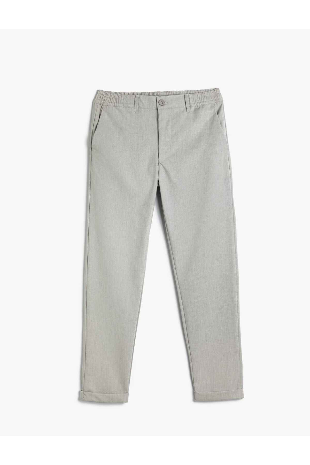 شلوار تناسب باریک با جیب الاستیک با دکمههای لایهای