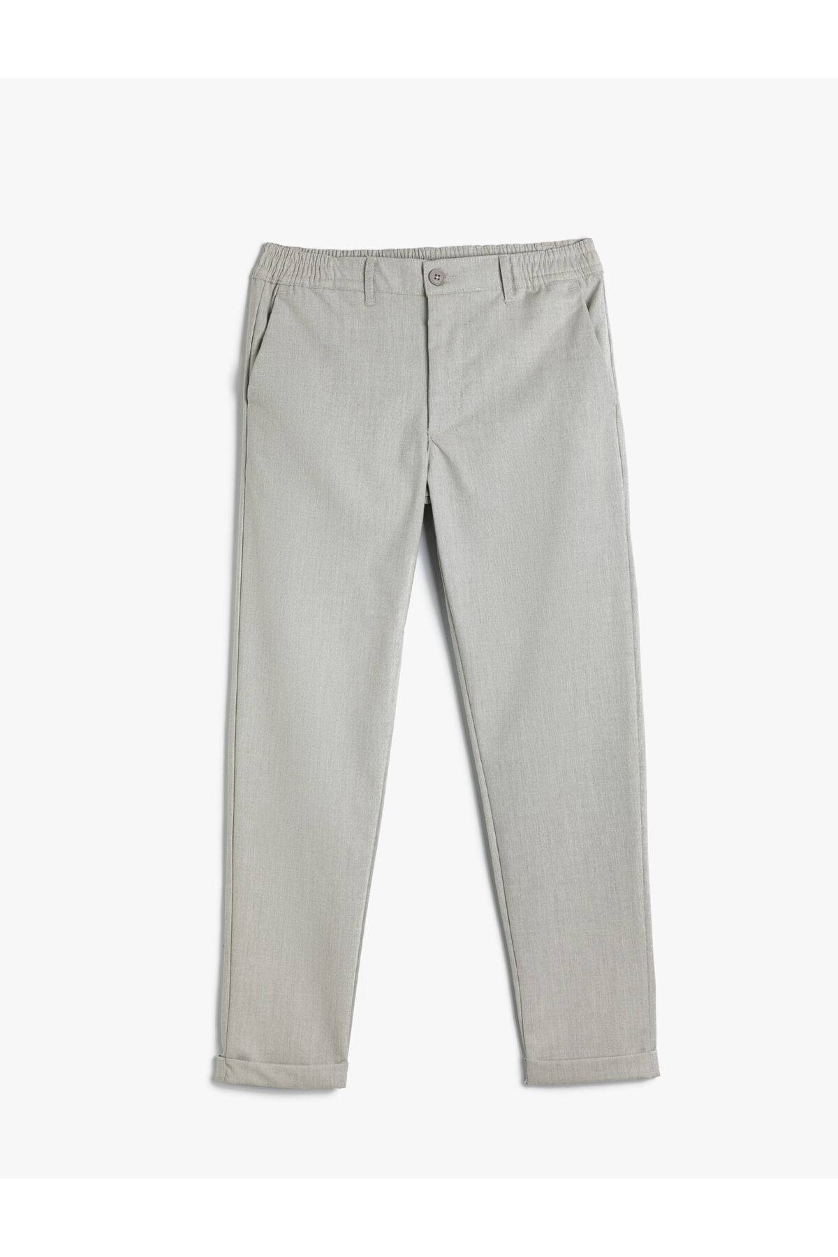 شلوار تناسب باریک با جیب الاستیک با دکمههای لایهای