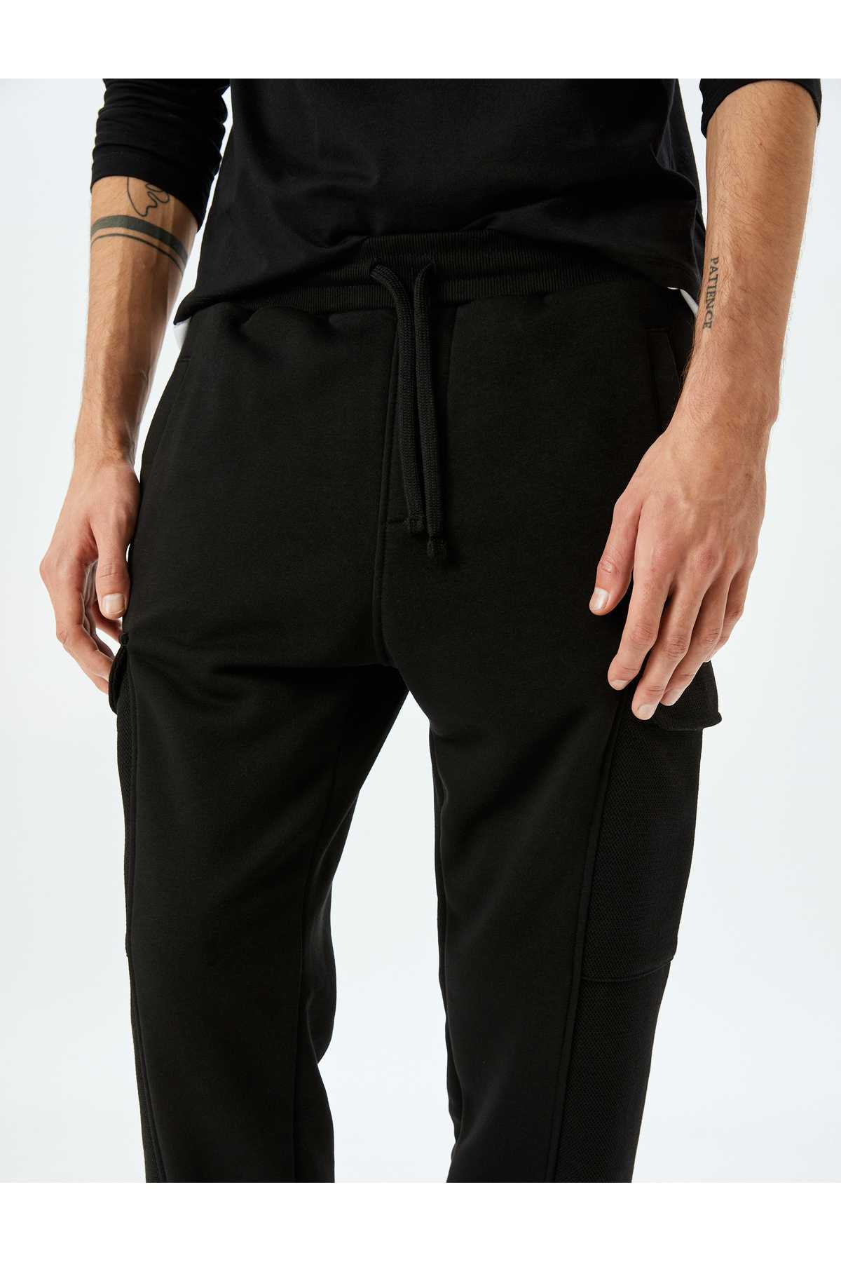 شلوار ورزشی ترکیبی پنبه ای با کمر بسته و جیب باری