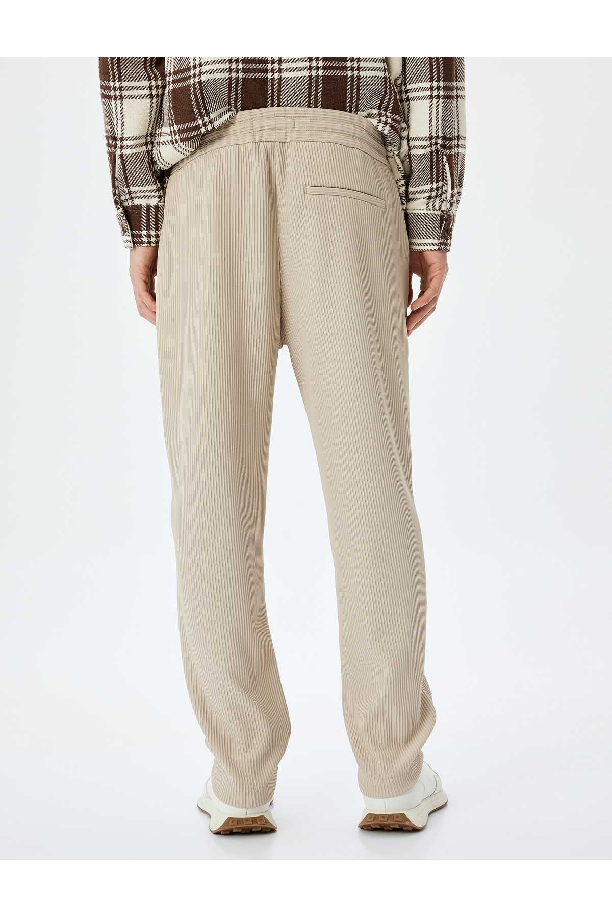 شلوار دندهدار جیبی با جزئیات با کمربند