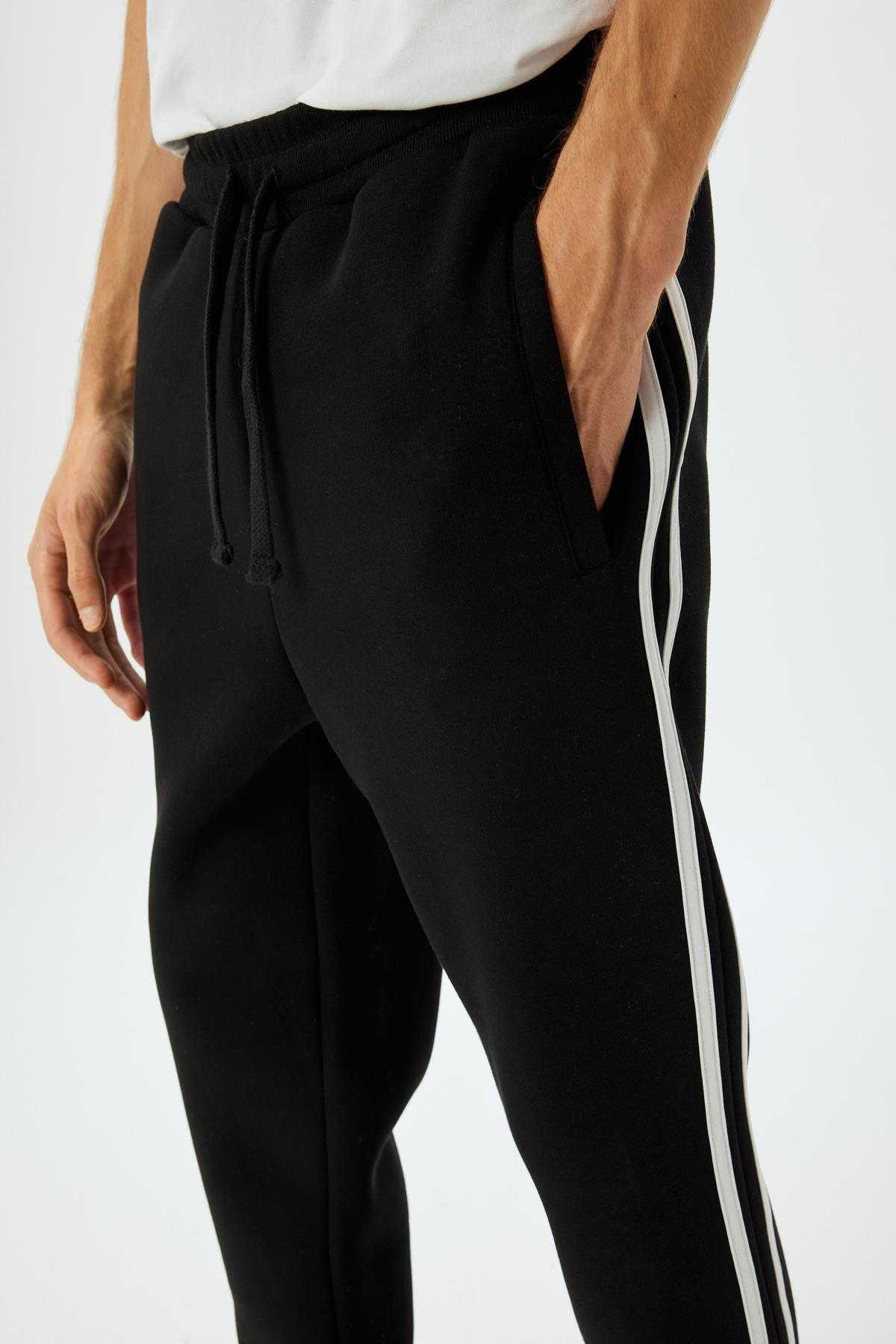 شلوار ورزشی با جیب توری بلند شده از جنس پنبه