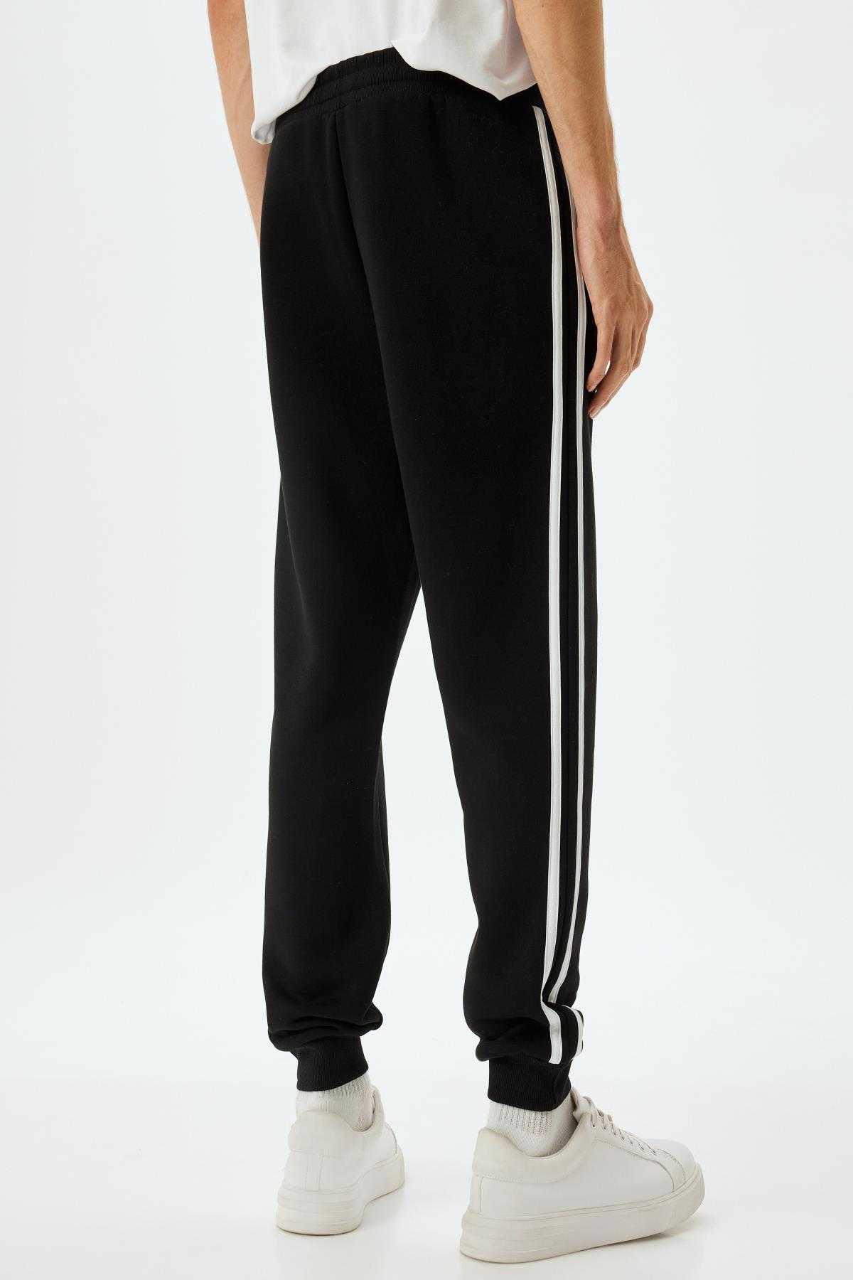 شلوار ورزشی با جیب توری بلند شده از جنس پنبه